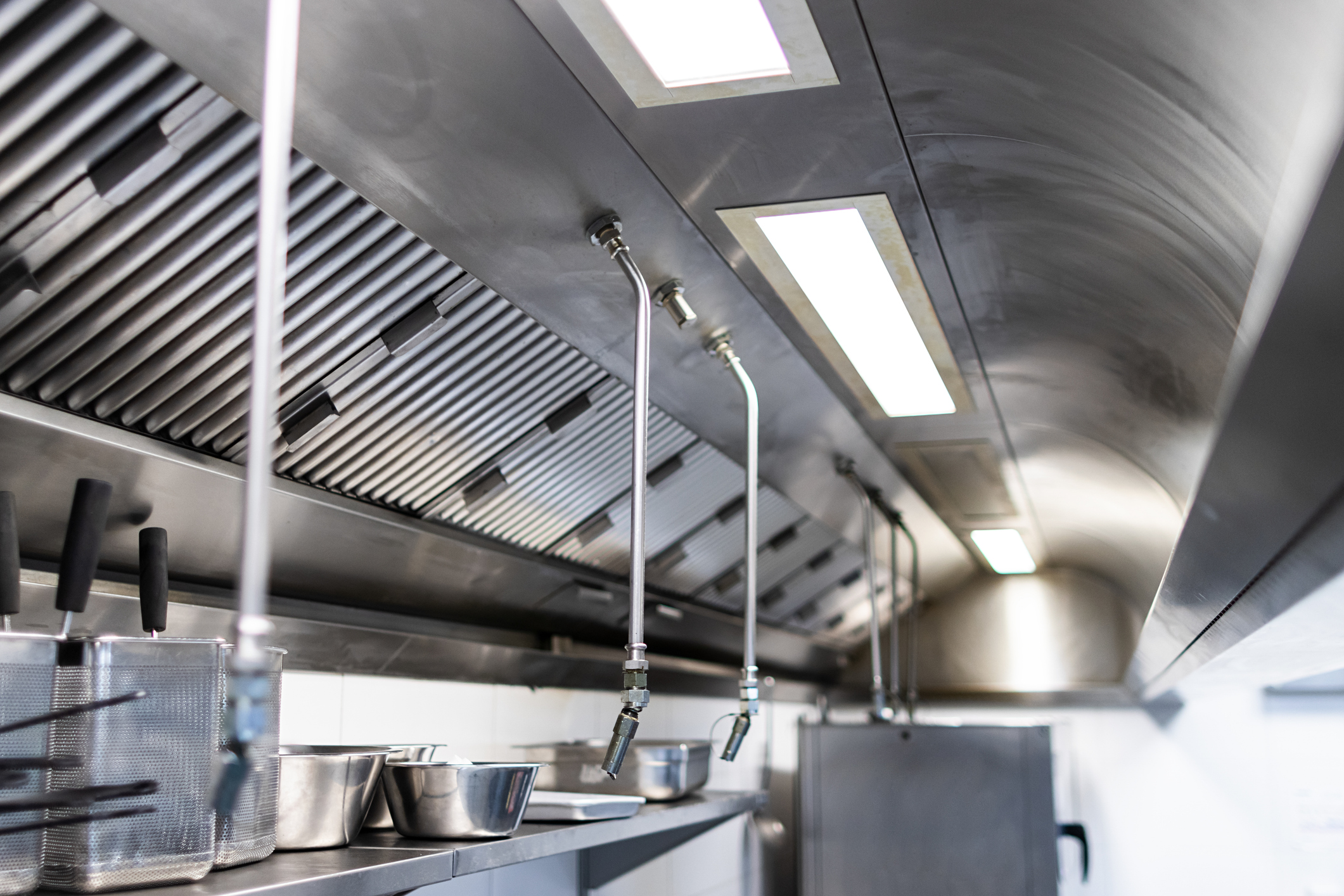 Commercial hood fire suppression system protecting kitchen staff
